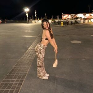 Selling the brown zebra and cream pants